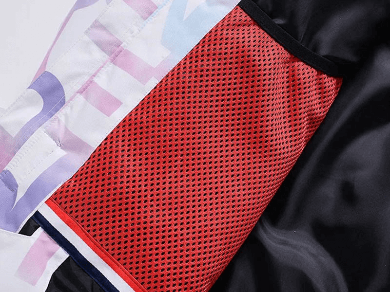 Close-up of stylish letter printed ski jacket pocket with red mesh detail for female skiers, SF1787.